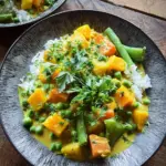 Vegetarisches Kürbis-Curry mit Erbsen (mild scharf)